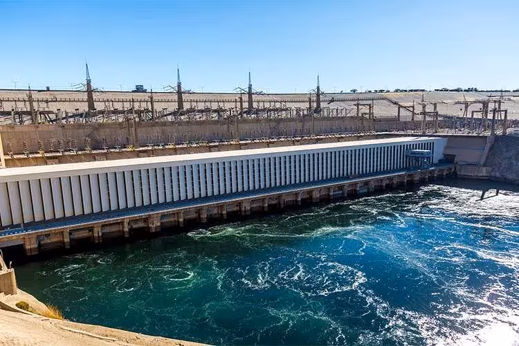 Aswan High Dam spillway with rushing Nile water, key stop on Aswan City Tour to Philae and obelisk