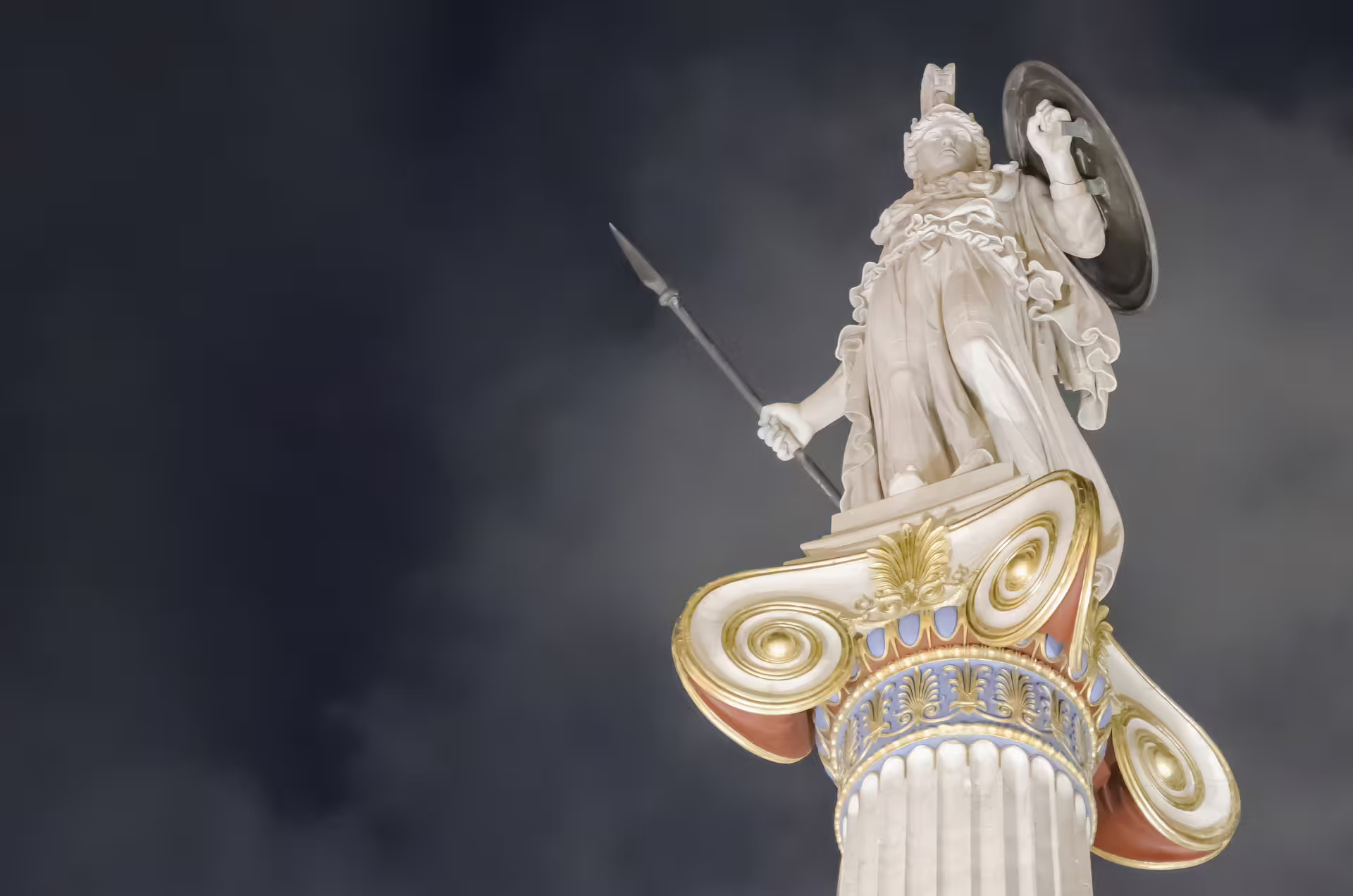 Athena statue atop an ornate column at the Academy of Athens, featured on an ancient Athens private tour