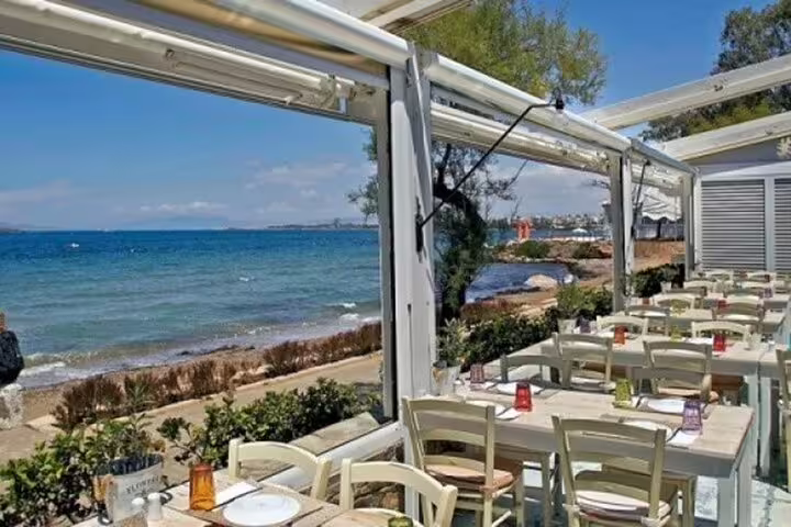 Seaside taverna terrace on the Athenian Riviera, perfect lunch stop on a summer day trip from Athens