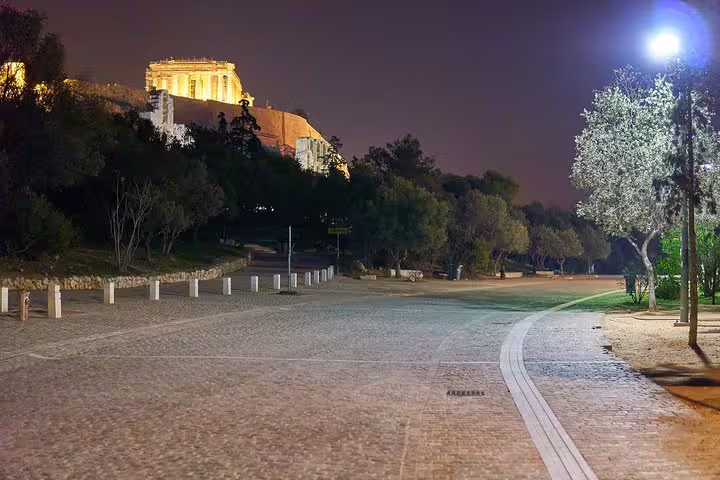 Night view of the Acropolis and Parthenon from a quiet path on an Athens private walking tour with entry