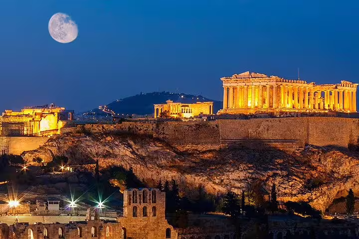 Illuminated Acropolis and Parthenon at night in Athens, Greece, featured on an Athens highlights private tour