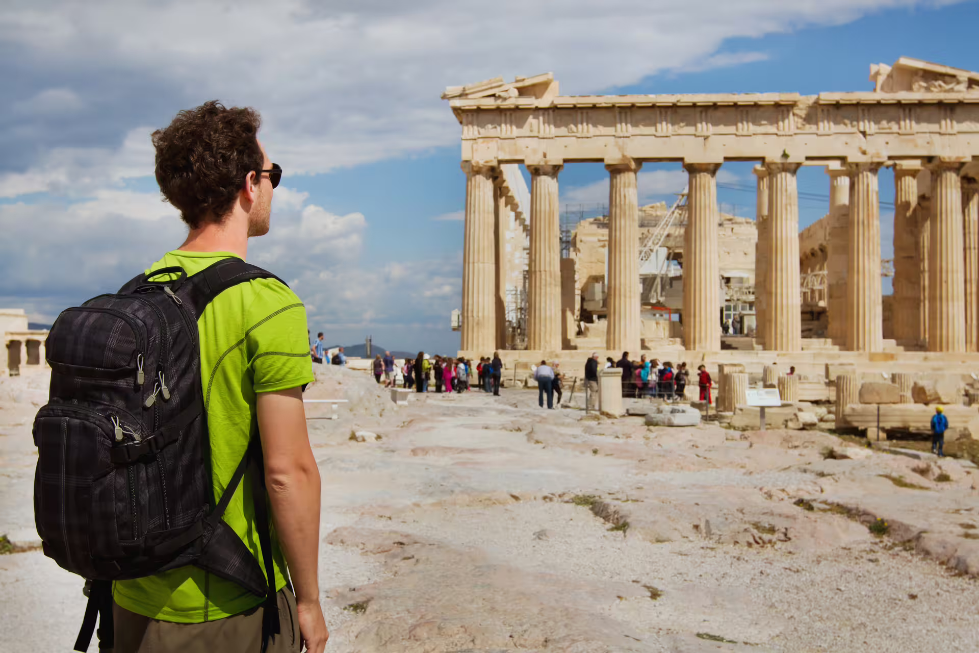 Traveler facing the Parthenon on the Acropolis, Athens small group sightseeing tour with skip-the-line tickets