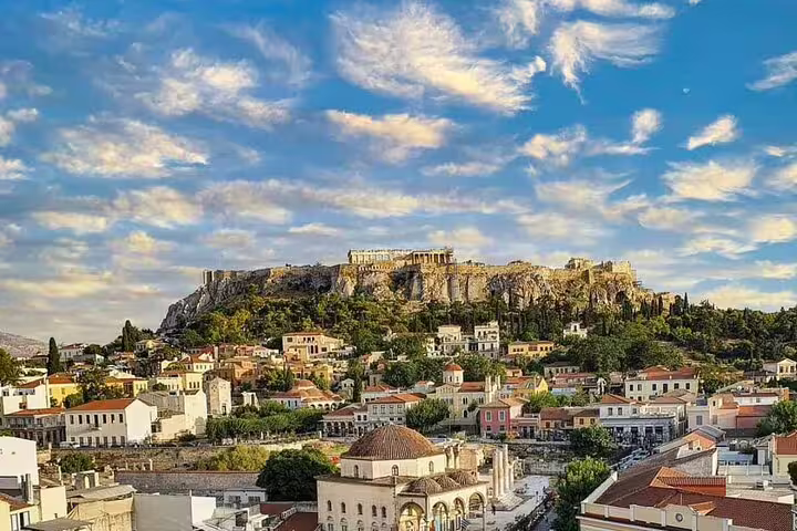 Athens cityscape with Acropolis hill under blue sky, perfect backdrop for Athens center to Piraeus Port private transfer