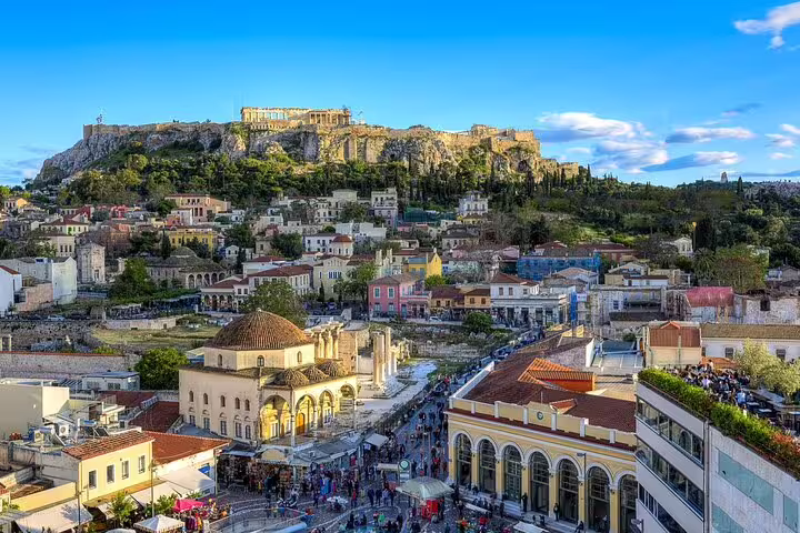 Athens cityscape with Acropolis hill in daylight, ideal for Athens center to Piraeus port private transfer