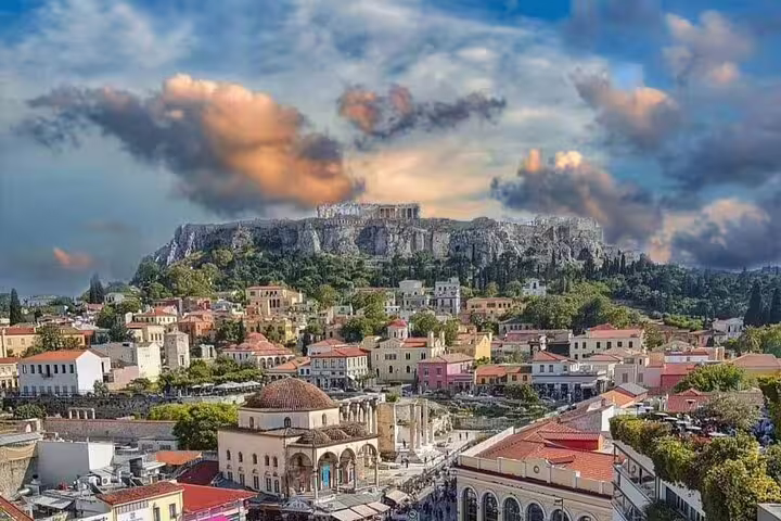 Athens cityscape with Plaka rooftops and the Acropolis hill at sunset on a private car tour with local