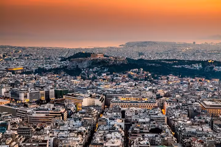 Athens panoramic sunset view with Acropolis lit above the city, small group tour ending in Plaka at night