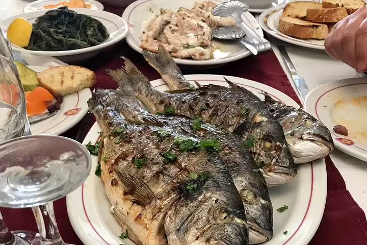 Grilled whole fish with Greek sides, local taverna meal on Athens half-day private Acropolis and highlights tour