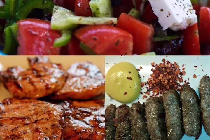 Greek dinner tasting in Athens with horiatiki salad, grilled meats and meze, part of an afternoon city tour