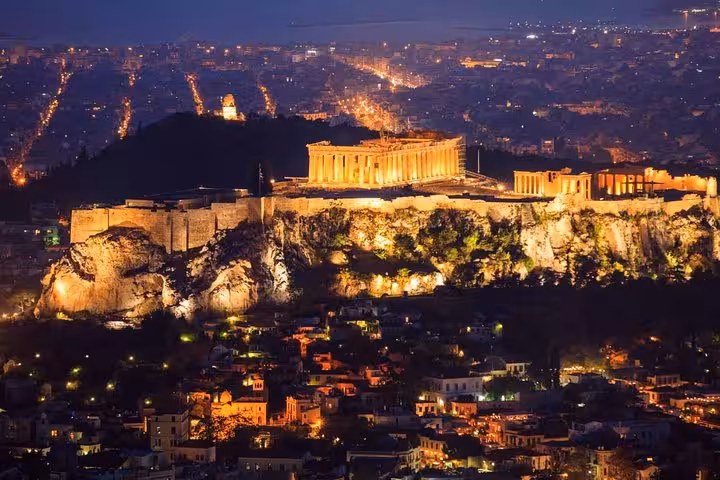 Illuminated Acropolis of Athens at night, ideal backdrop for Athens Airport to hotel luxury private transfer