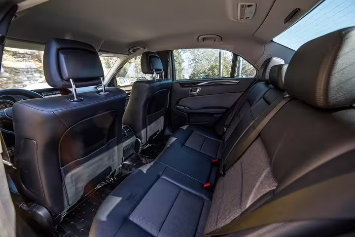 Luxury sedan rear seats for Athens airport to Piraeus port private transfer with comfortable leather interior