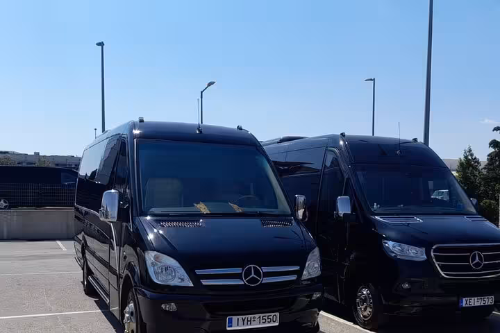 Black Mercedes luxury vans ready for private transfer from Athens Airport to Piraeus Port cruise terminal