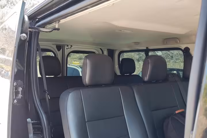 Luxury private transfer van interior with leather seats for Athens Airport to Piraeus Port hotel ride