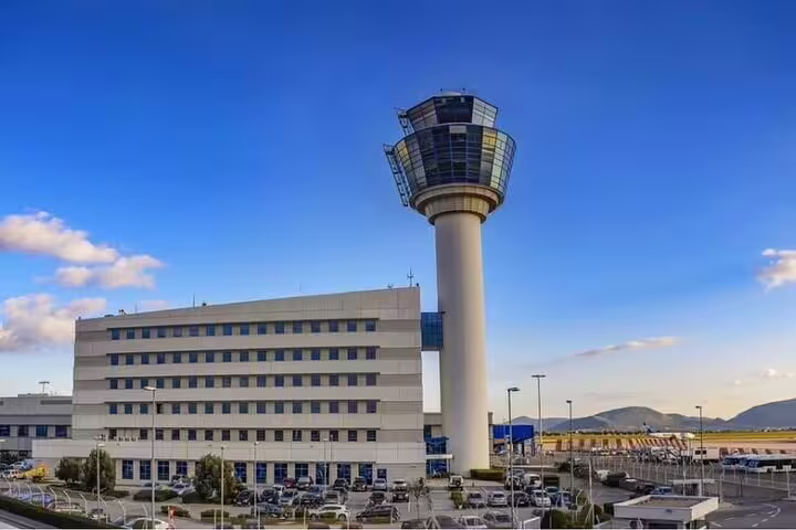 Athens International Airport control tower, pickup point for private arrival transfer to Piraeus Port cruise terminal