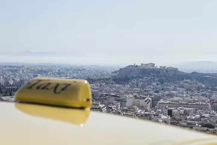 Taxi sign with panoramic Athens view, ideal for Athens Airport to Athens hotels private arrival transfer service