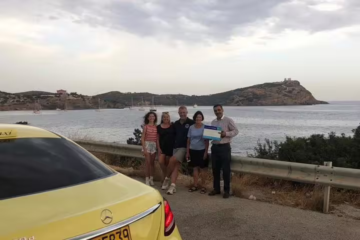 Private Athens transfer tour group photo by seaside viewpoint, ideal for airport or port pickup and quick tour