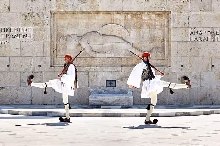 Evzones guards in Athens Syntagma Square, cultural photo stop on private luxury transfer from Athens hotels to airport