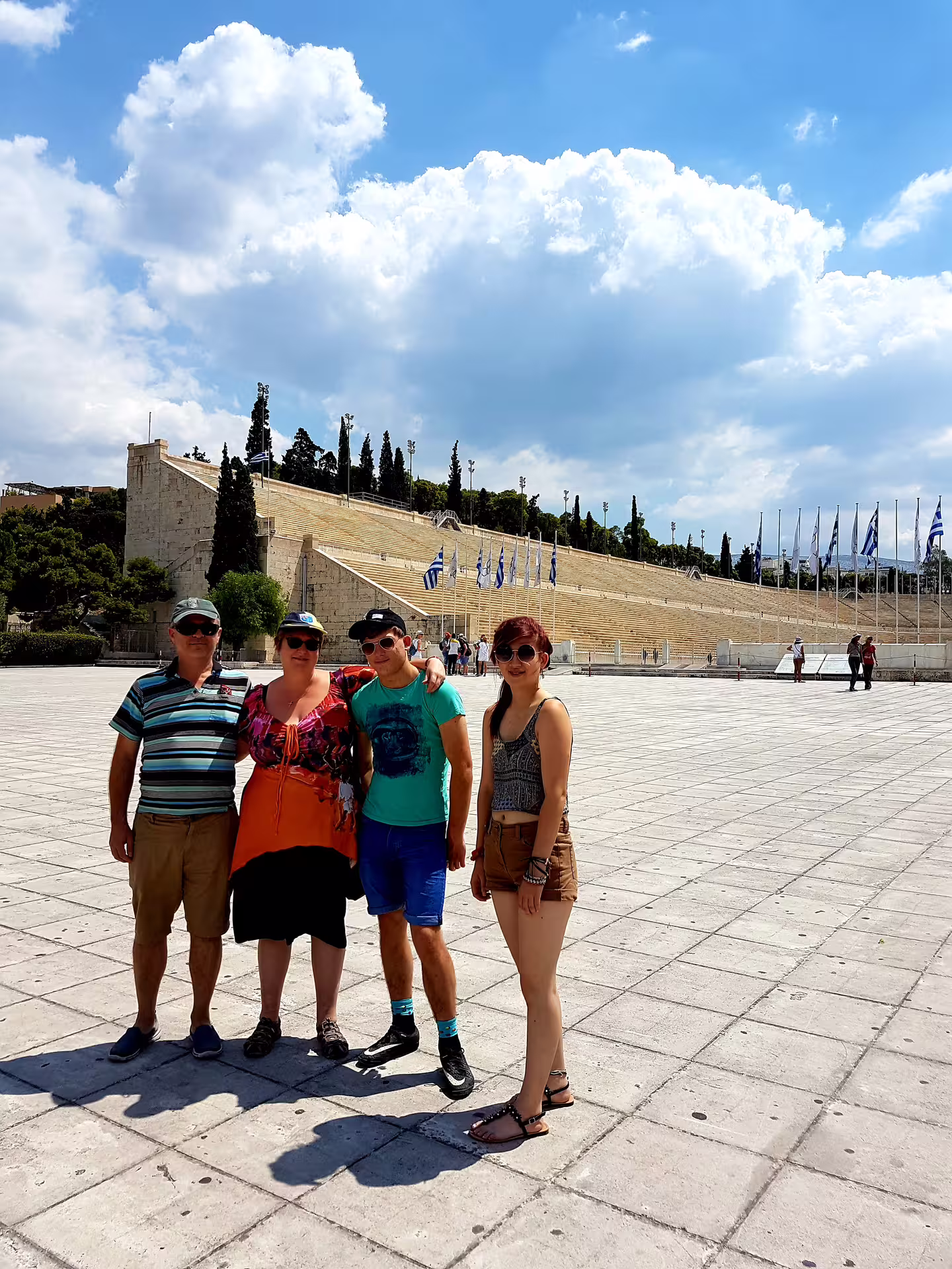 Group photo at Panathenaic Stadium plaza during an Athens classical full-day private tour with local guide