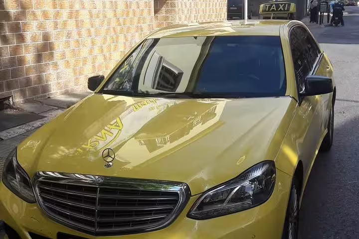 Yellow Mercedes taxi in Athens, private transfer vehicle option from Athens to Costa Navarino resort