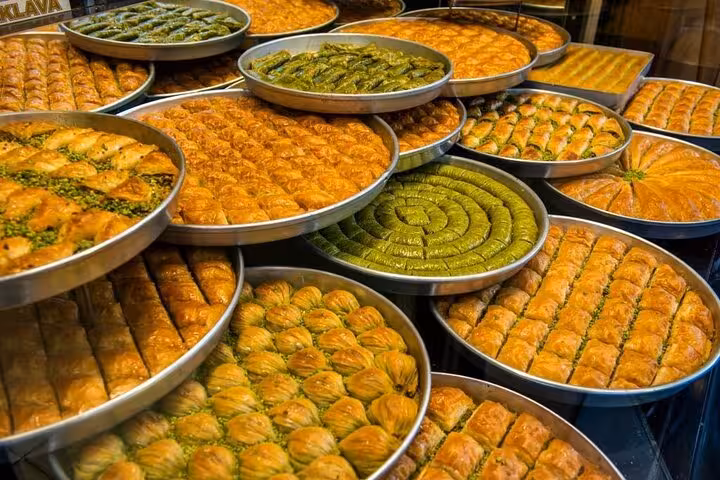 Indulge in a variety of traditional Greek baklava at a local bakery on the Athens food tour, highlighting sweet delights.