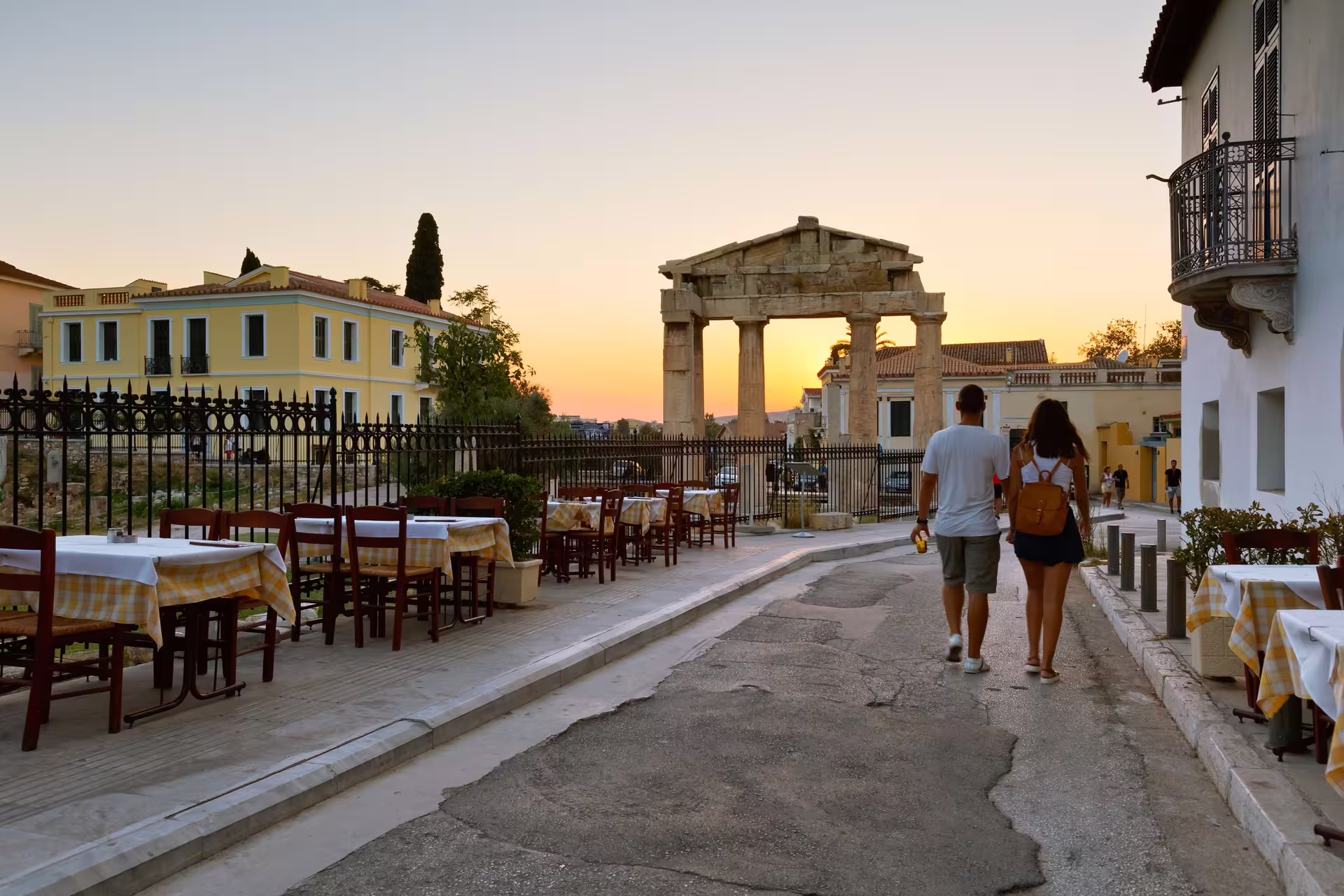 Sunset stroll past Athens Roman Agora with outdoor tavernas, a stop on the small-group afternoon food tour