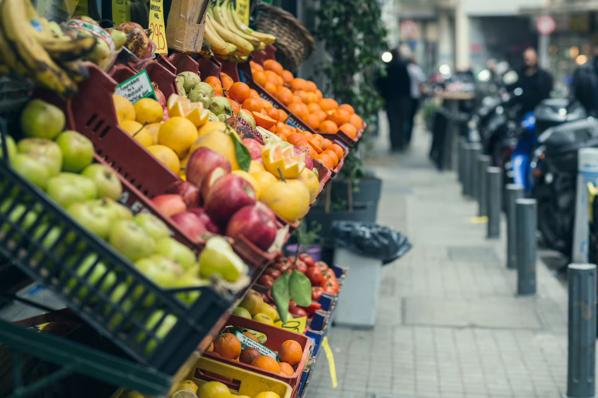 Colorful fruit stand on an Athens street market, tasting local produce on a small-group afternoon food tour