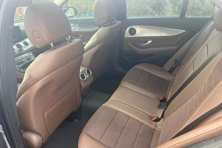 Comfortable rear-seat interior of private sedan for Athens city center to Lavrio Port departure transfer