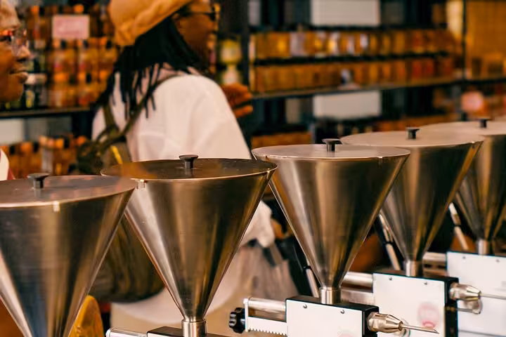 Olive oil tasting funnels in an Athens deli on a small group walking food tour designed for cruise travelers