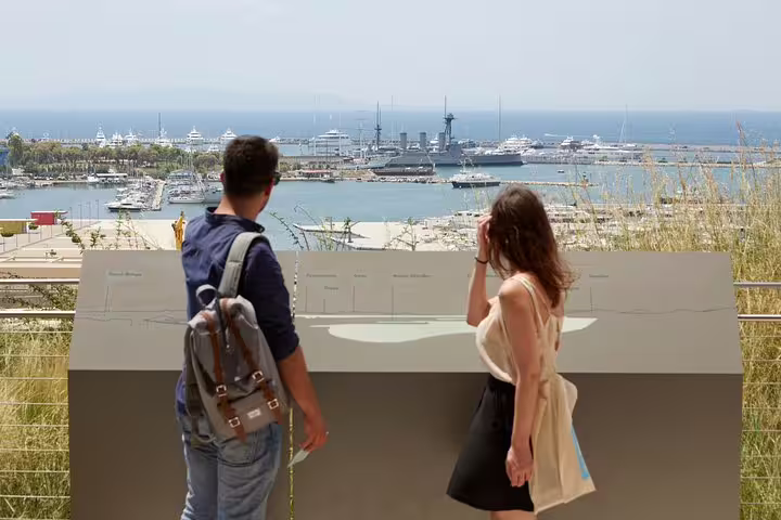 Travelers overlooking Piraeus Port from Athens viewpoint on a private half-day sightseeing ride with guide