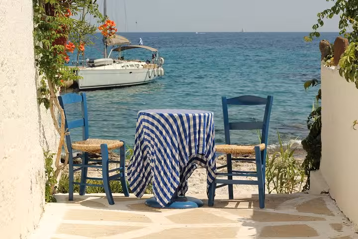Seaside taverna table by the Saronic Gulf, perfect stop on Athens all day cruise with lunch