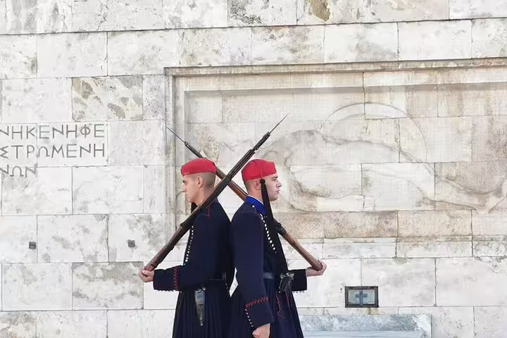 Evzones guards at Syntagma Square in Athens, landmark view during private departure transfer to Piraeus Port