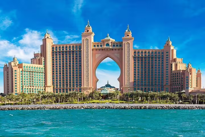 Majestic Atlantis The Palm hotel in Dubai, showcasing iconic architecture against a clear blue sky.