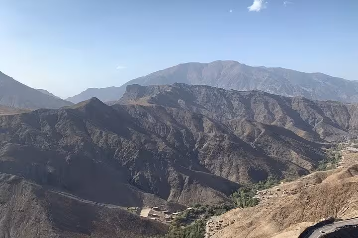 Vast panoramic view of the Atlas Mountains, highlighting the rugged terrain on the Morocco desert tour route.