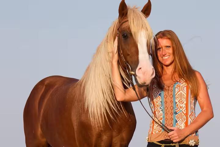 Traveler with horse in Sharm El Sheikh desert, a scenic add-on to sunrise or sunset ATV quad adventure