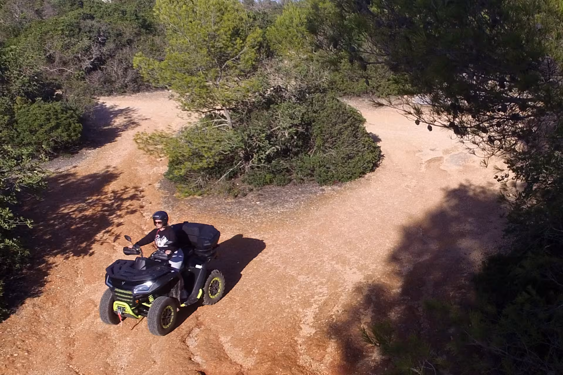 Aerial view of an ATV navigating the rugged terrain of the seven Hanging Valleys, showcasing the exciting off-road adventure.