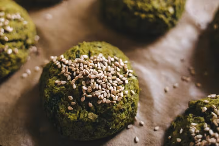 Close-up of traditional Egyptian falafel topped with sesame seeds, showcasing Cairo's authentic street food experience.