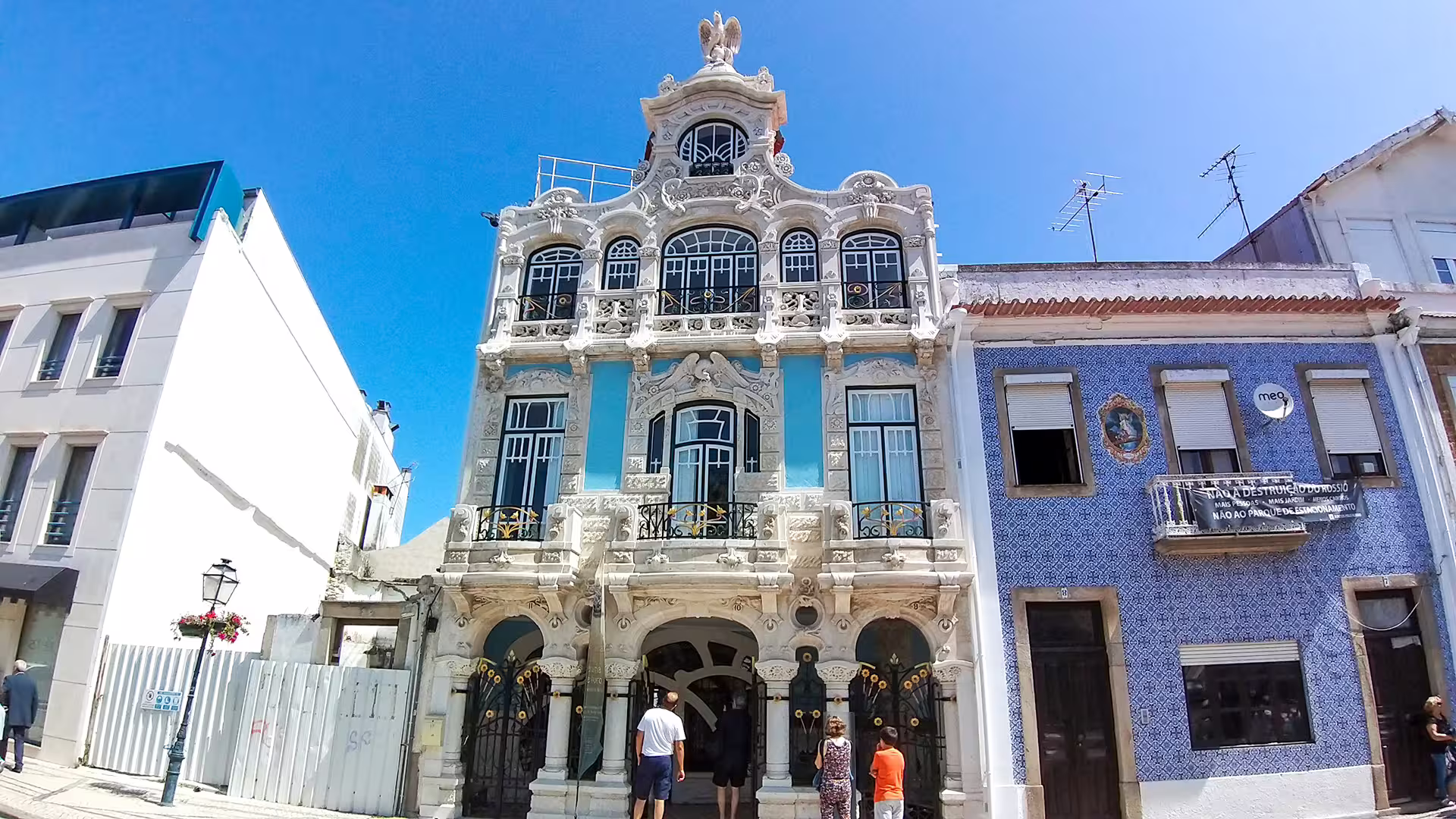 Ornate blue and white buildings in Aveiro, showcasing unique architecture on a sunny day during a private Costa Nova tour.
