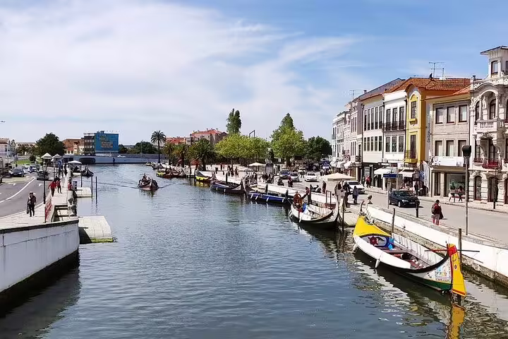 Experience a leisurely boat ride along Aveiro's picturesque canals during the private full-day tour from Porto.