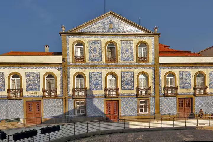 Historic building in Aveiro adorned with traditional Portuguese azulejos, featured on a small-group half-day tour.