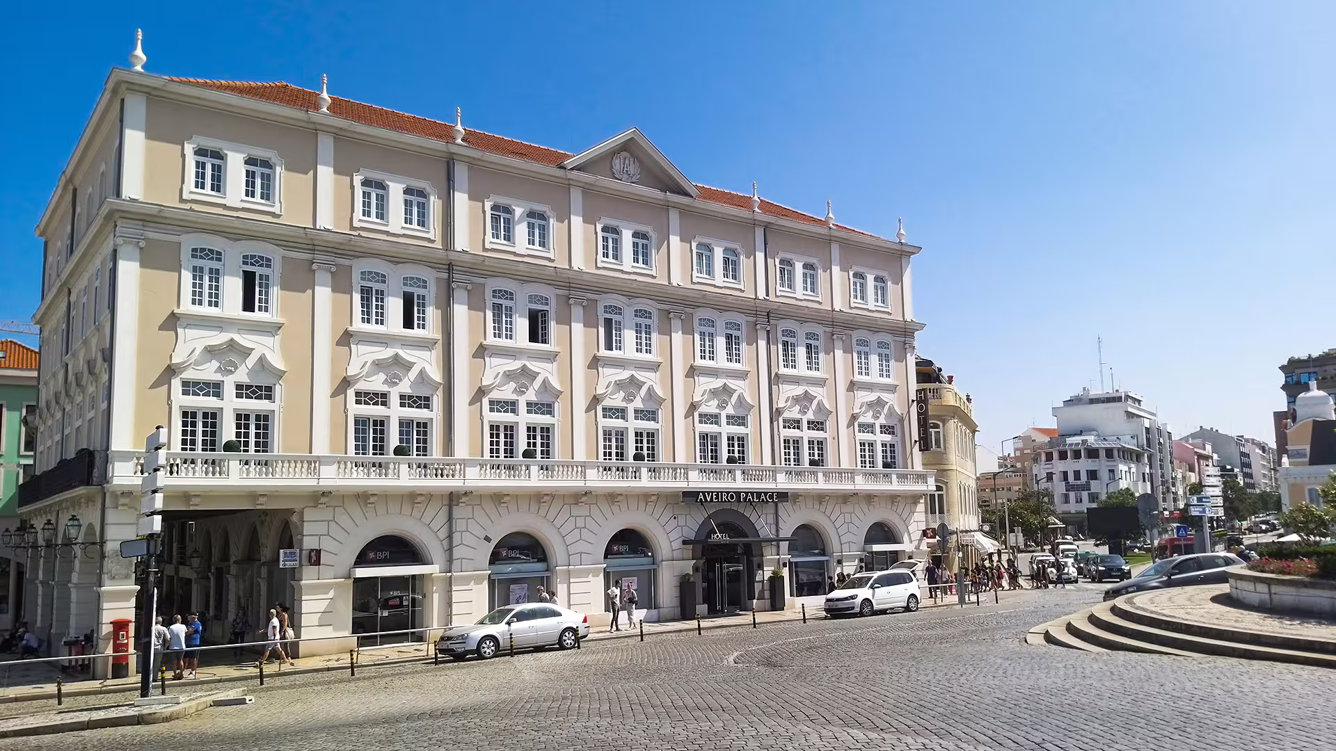 Elegant historic building in Aveiro, Portugal, showcasing Neoclassical architecture on a sunny day, perfect for a Porto to Lisbon tour.