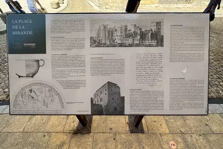 Historic info panel at Place de la Mirande, Avignon, featured on a private full-day wine tour to Châteauneuf-du-Pape