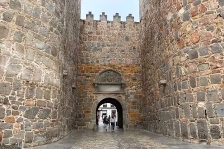 Medieval stone gate in Ávila city walls, highlight of Avila half-day private tour by minivan