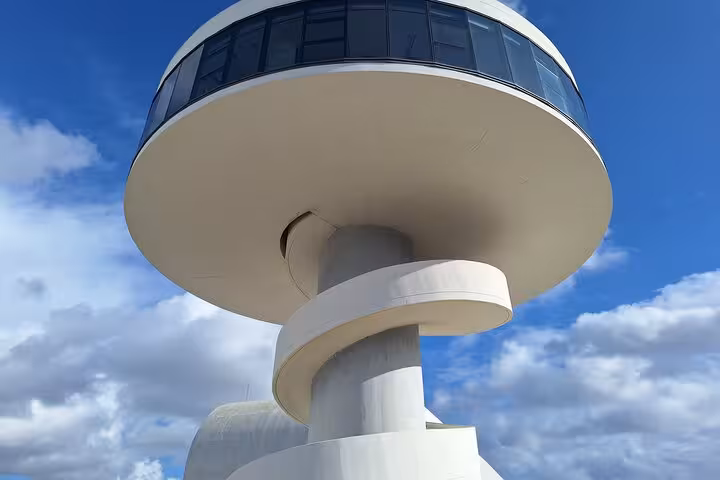 Modern architecture of Avilés Cultural Center under a clear blue sky, a highlight of the Oviedo tour.
