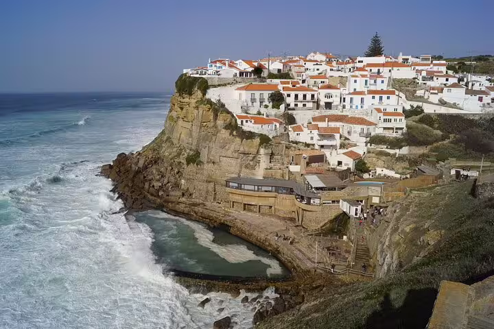 Azenhas do Mar scenic coastal village with white houses perched on cliffs overlooking the ocean, Sintra day tour highlight.