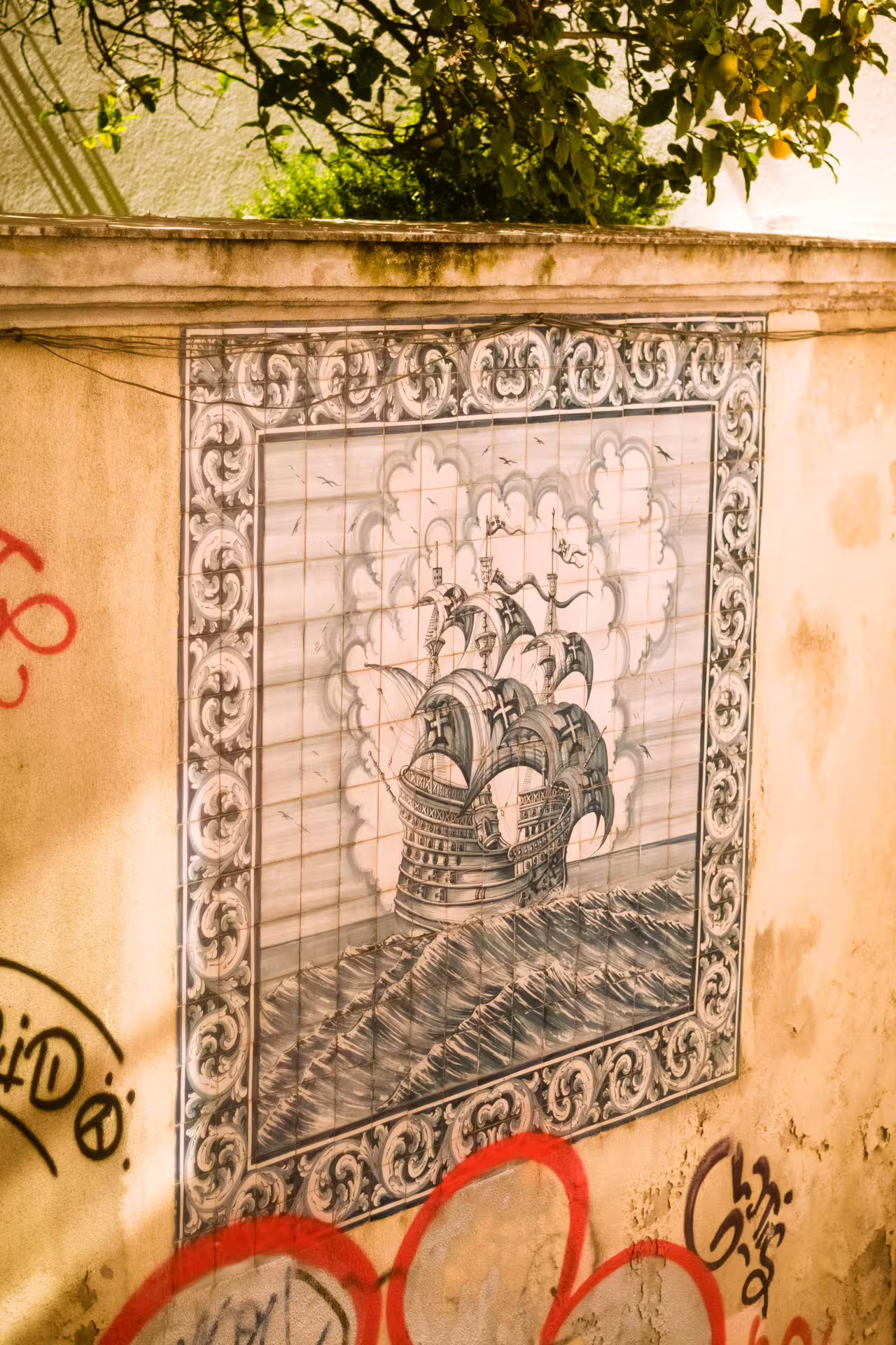 Azulejo tile art depicting a historic ship in Alfama, Lisbon, showcasing local culture on a guided photography walk.