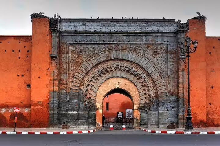 Ornate Bab Agnaou gate on Marrakech city walls, a highlight on a full-day sightseeing tour with a local guide