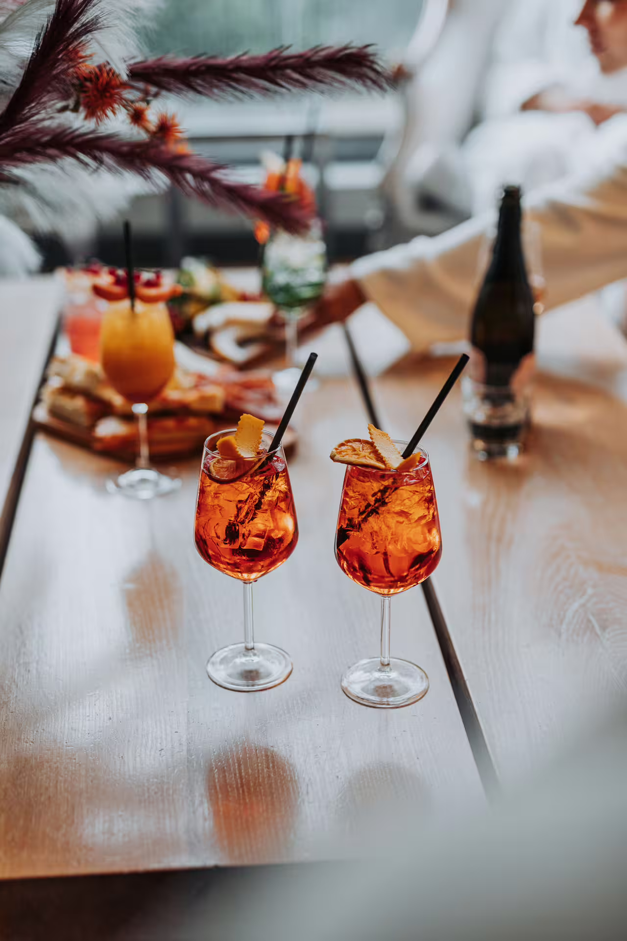 Aperitif cocktails on table at Bagno di Romagna spa lounge, perfect add-on after 25-min massage and thermal pool entry