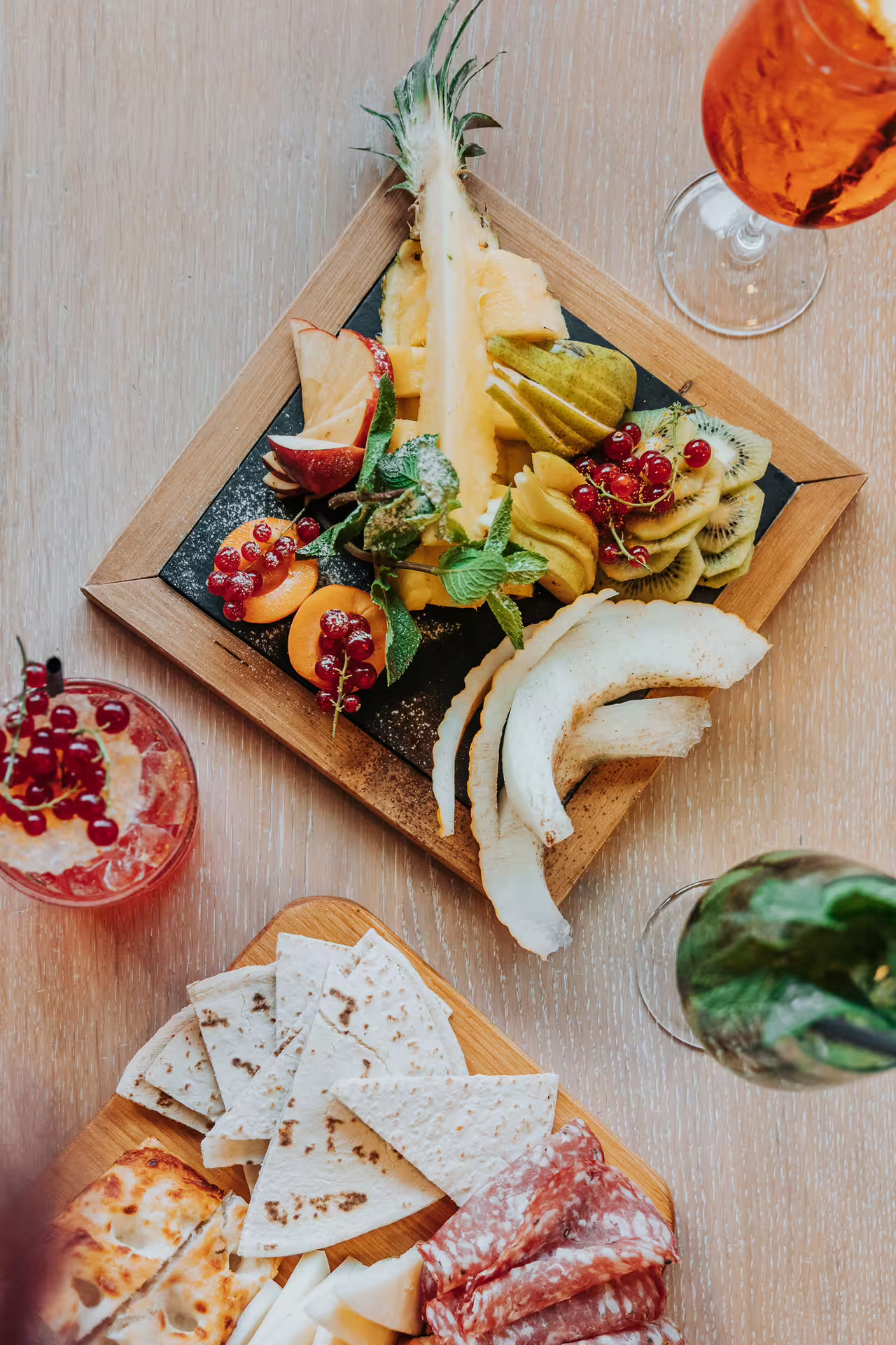 Aperitif spread with fresh fruit, cured meats and cocktails after Bagno di Romagna 2-hour thermal pool entry