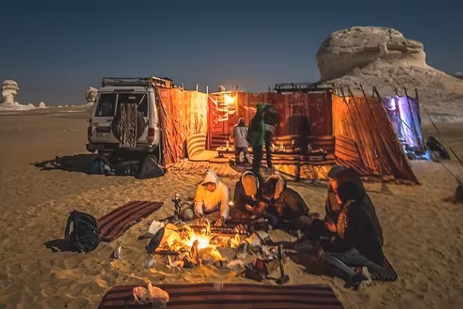 Campfire dinner at Bahariya Oasis desert camp on 2-day tour from Cairo, White Desert night camping