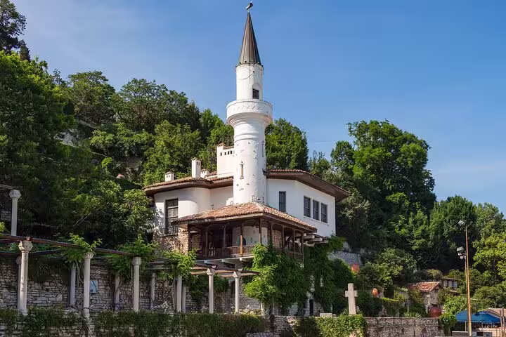 Marvel at the iconic tower of Balchik Palace, nestled amidst verdant hills, offering picturesque views on the walking tour.