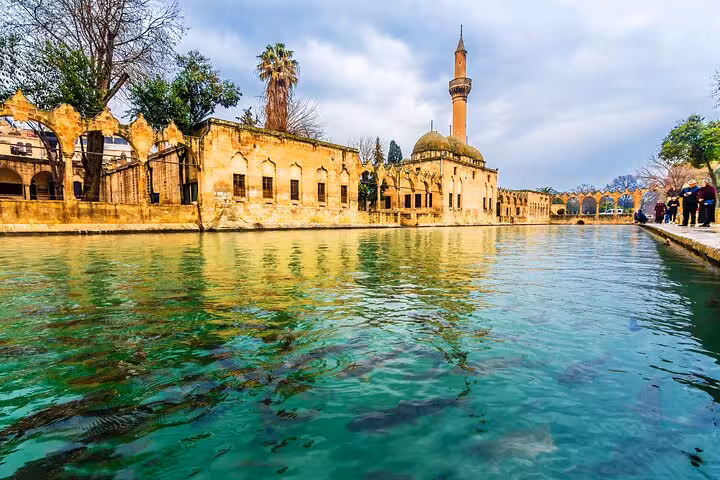 Clear waters of Balikligol Fish Lake and historic mosque complex in Sanliurfa on 2-day tour